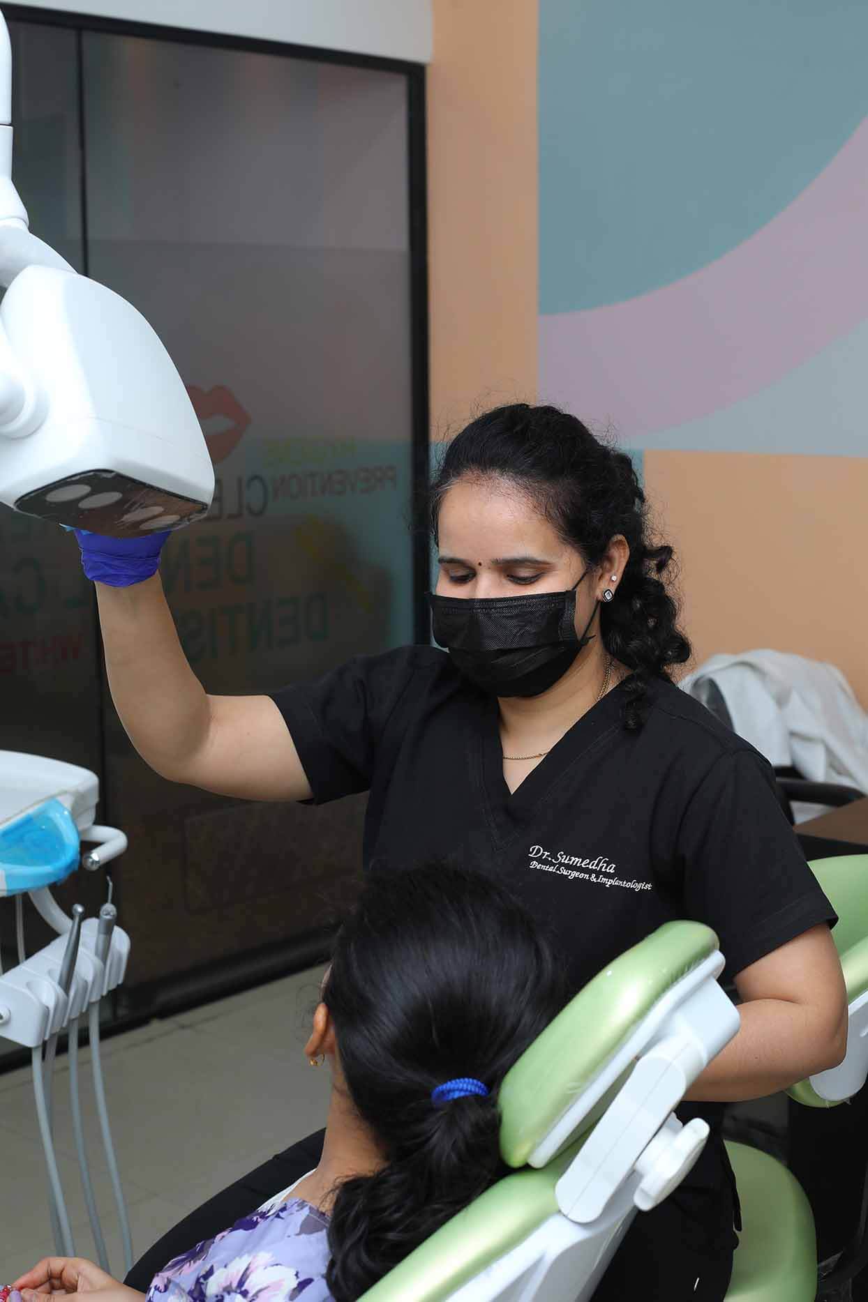 Dr. Sumedha preparing a patient for dental X-ray at Sharanya Dental, Kondapur