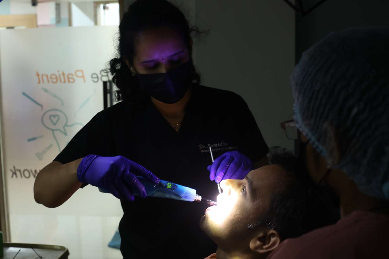 Dr. Sumedha performing laser-assisted dental treatment at Sharanya Dental Clinic, Kondapur